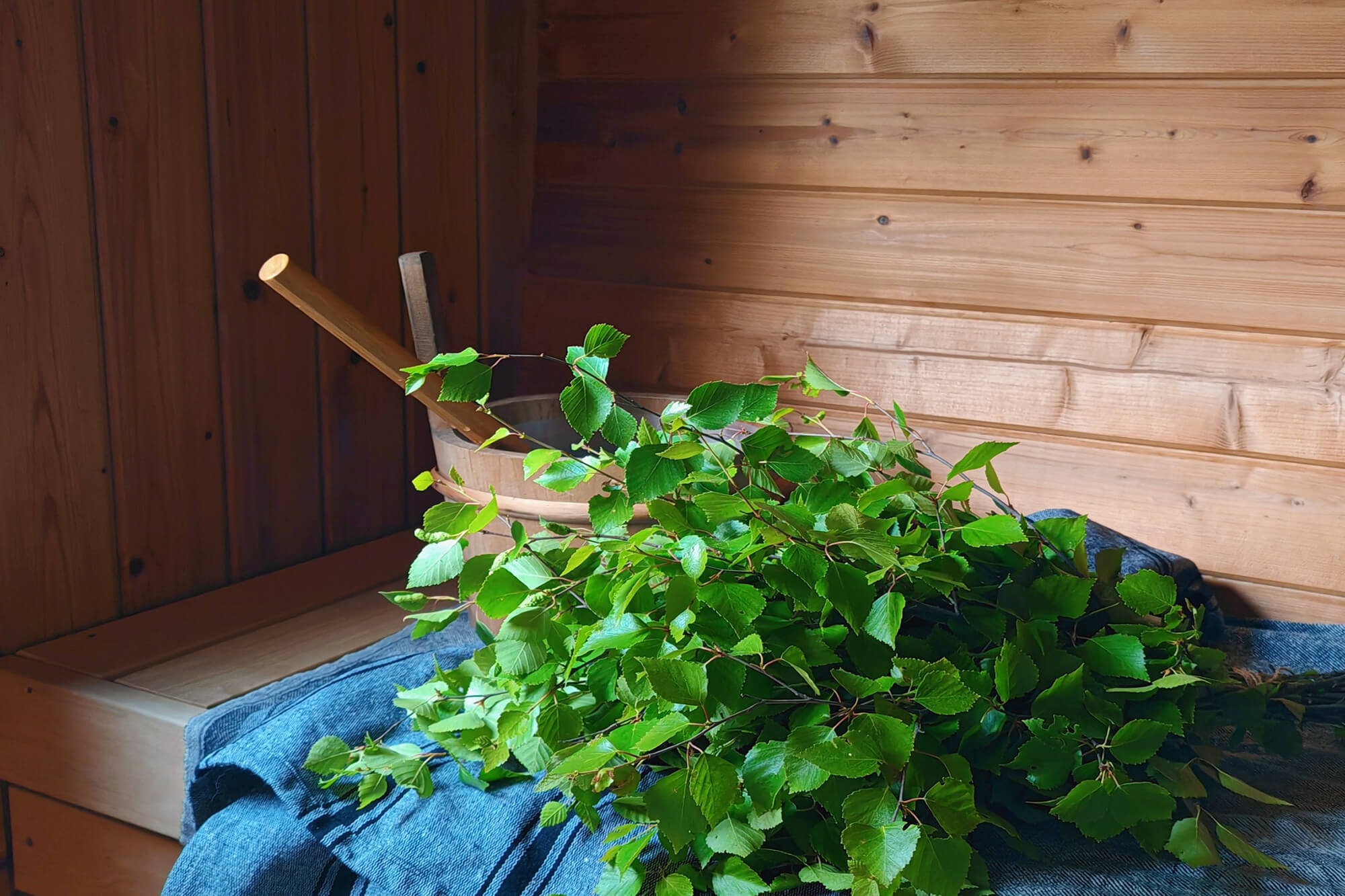 A birch whisk, called a vasta or vihta, is used in the Finnish sauna © GoSaimaa