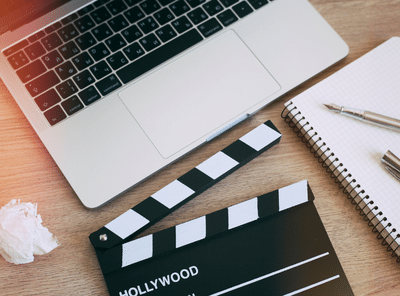 Video Editing,Movie clapper laptop and pencil notepad on the wood table top view@Saturn_3