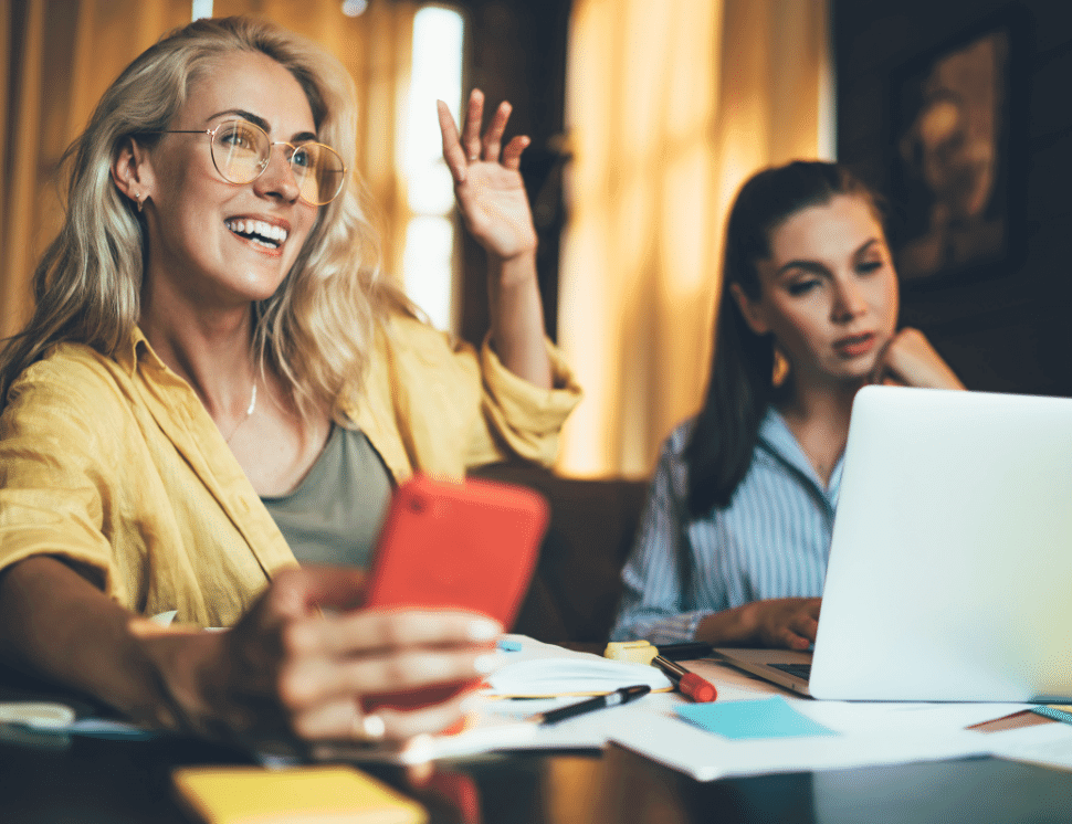 Two-women-with-smartphone-AdobeStock-970x746