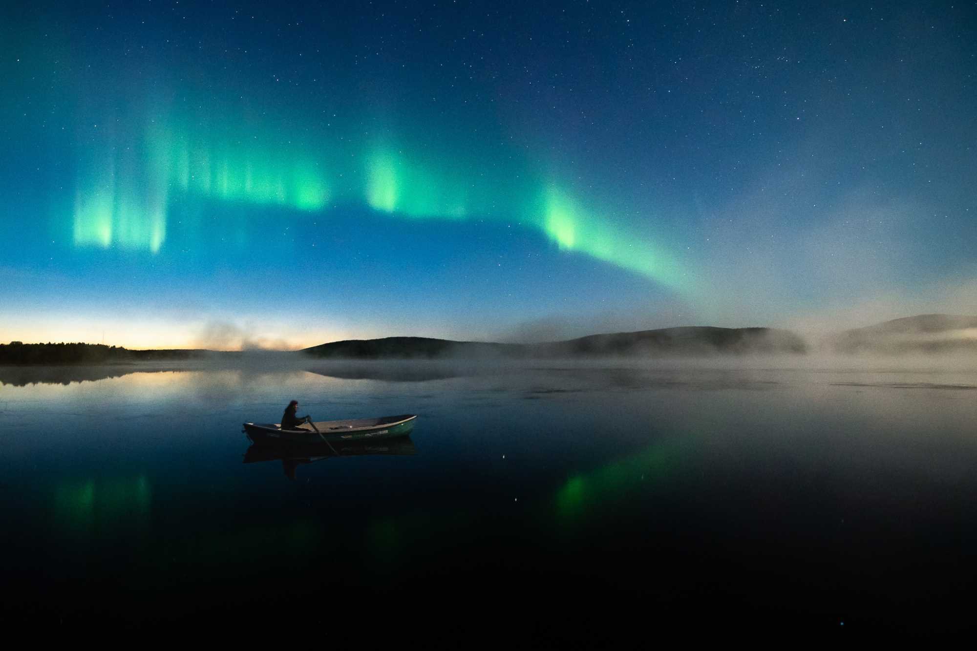 Yllas harvest season northern lights paddling boat lake Yllasjarvi