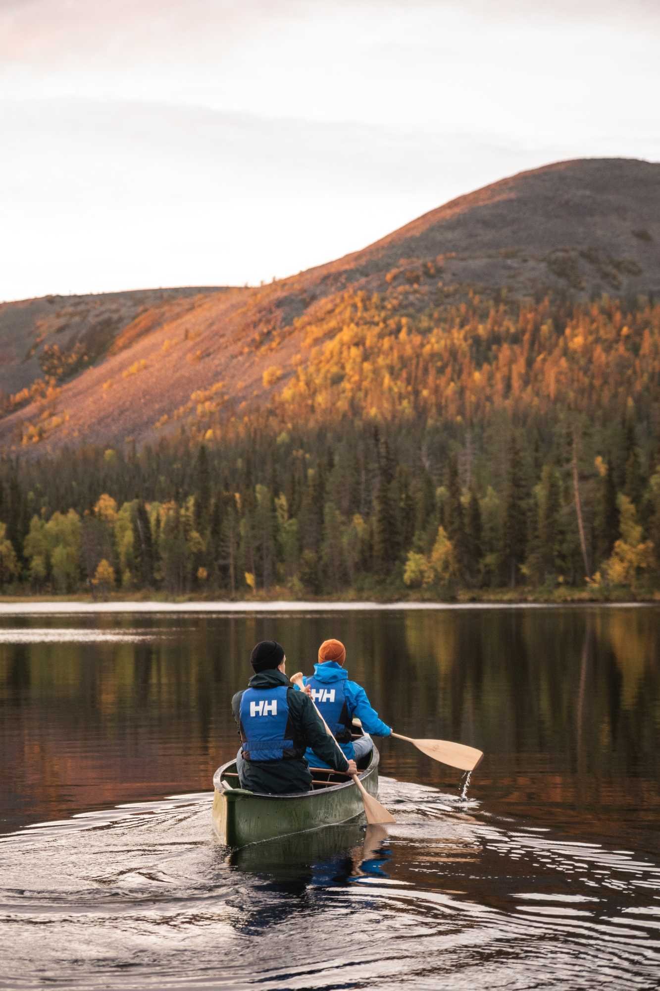 Yllas midnight sun paddling canoe lake Kesankijarvi