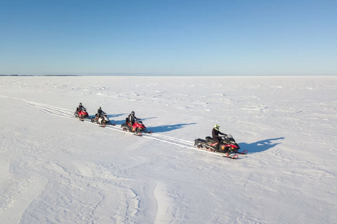 Snowmobiling on the frozen sea