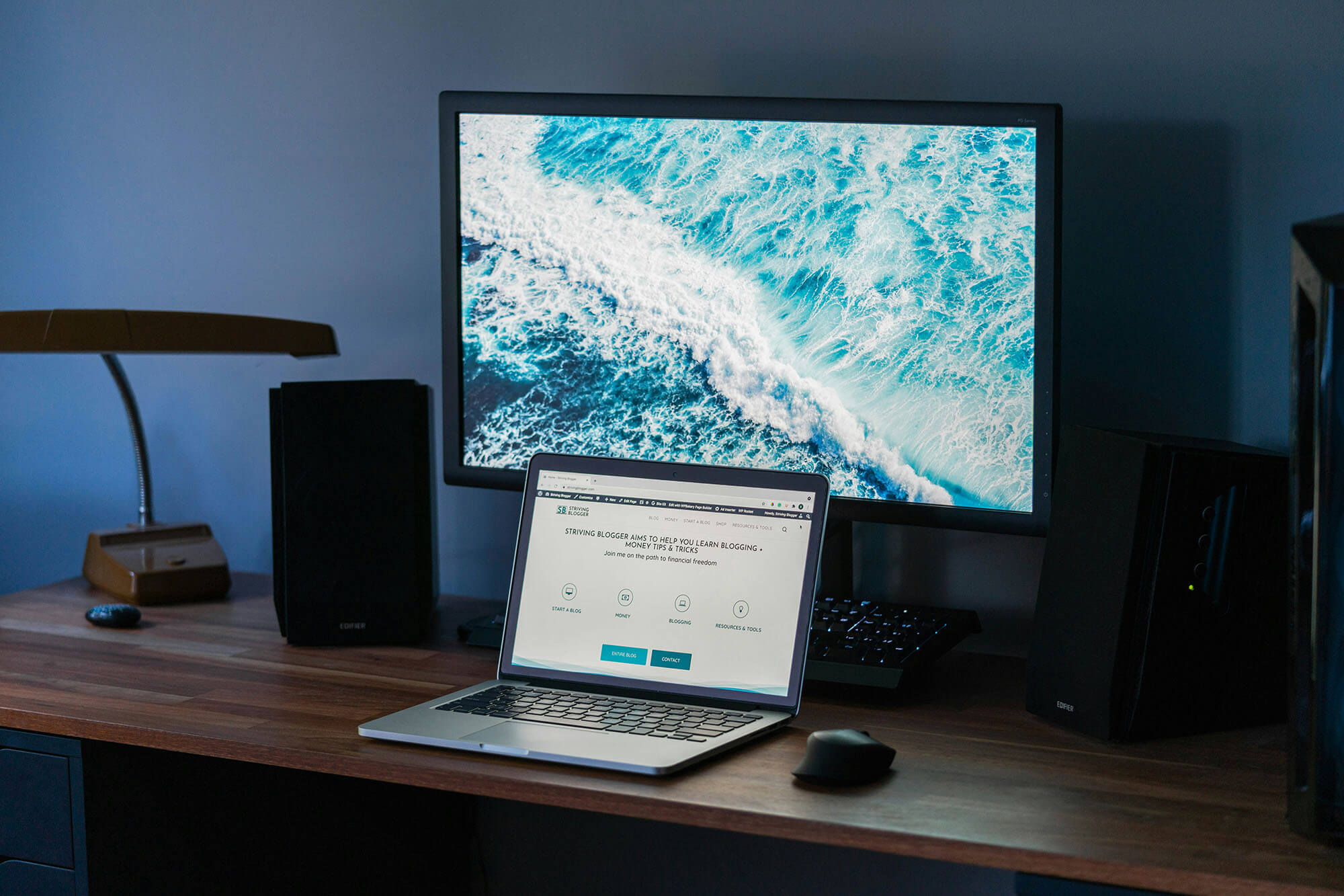 Laptop on wooden desk by Justin Morgan Unsplash