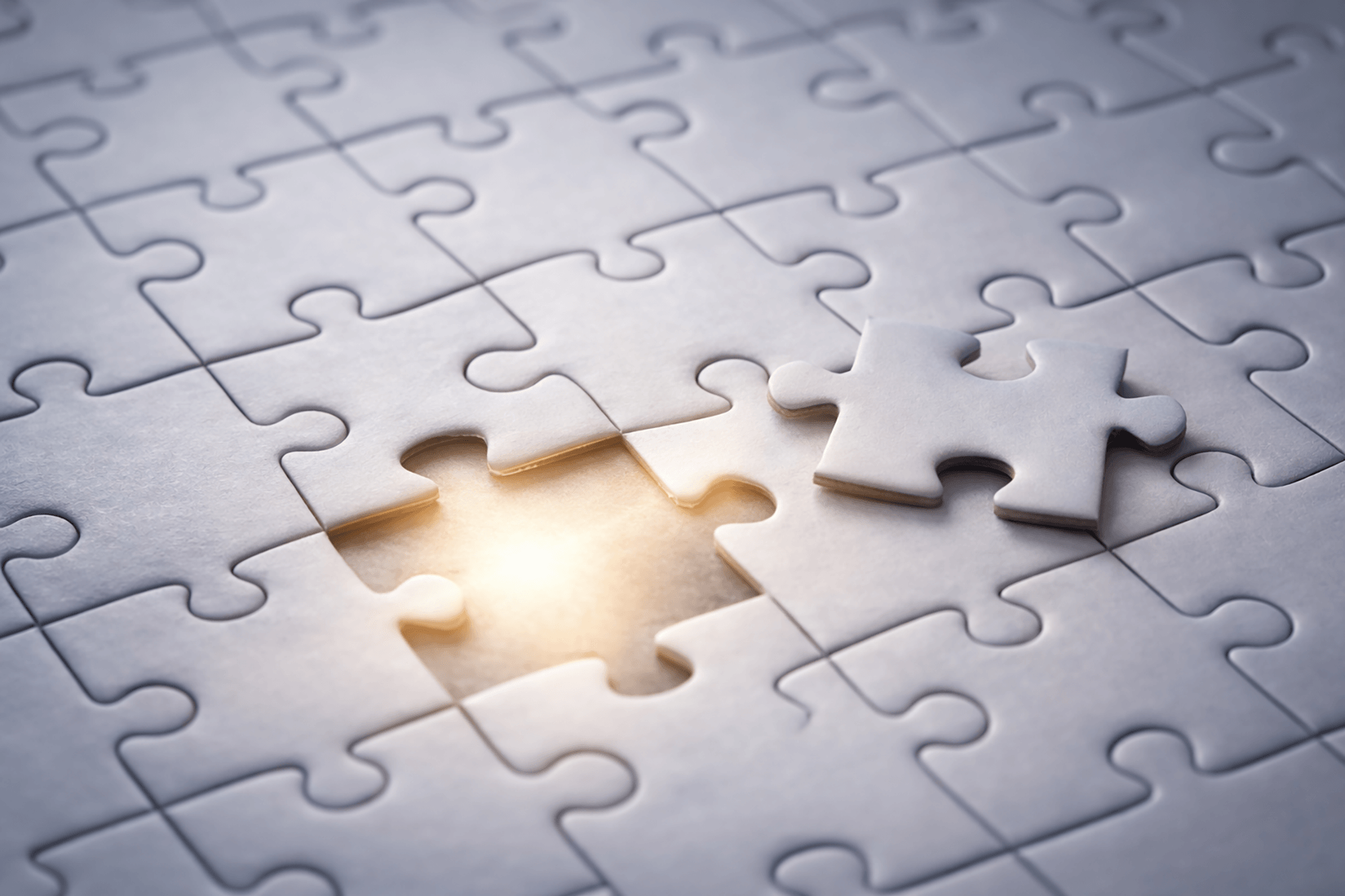 Puzzle with missing piece and glowing void